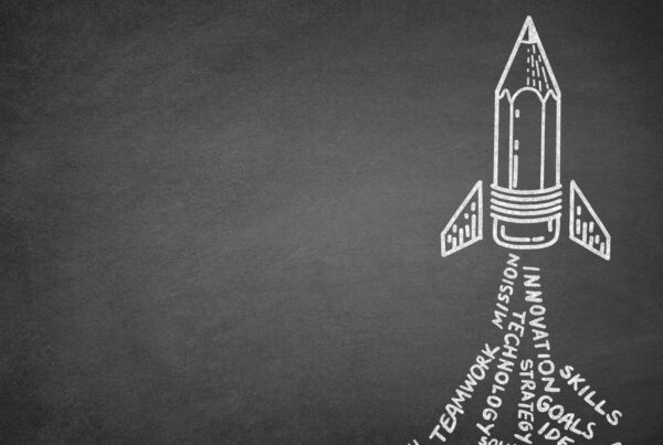 Chalk drawing of a pencil-shaped rocket launching from a blackboard, with words like “innovation,” “strategy,” and “teamwork” forming its trail—symbolising scaleup growth driven by core values.