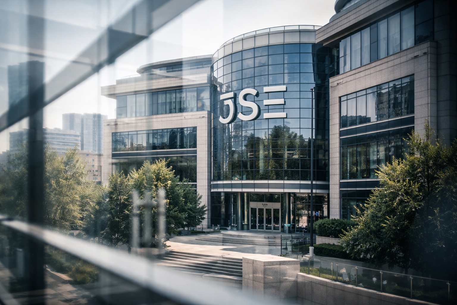 Johannesburg Stock Exchange building in Sandton viewed through glass, illustrating regulatory transparency and market oversight following the Information Regulator’s enforcement notice.