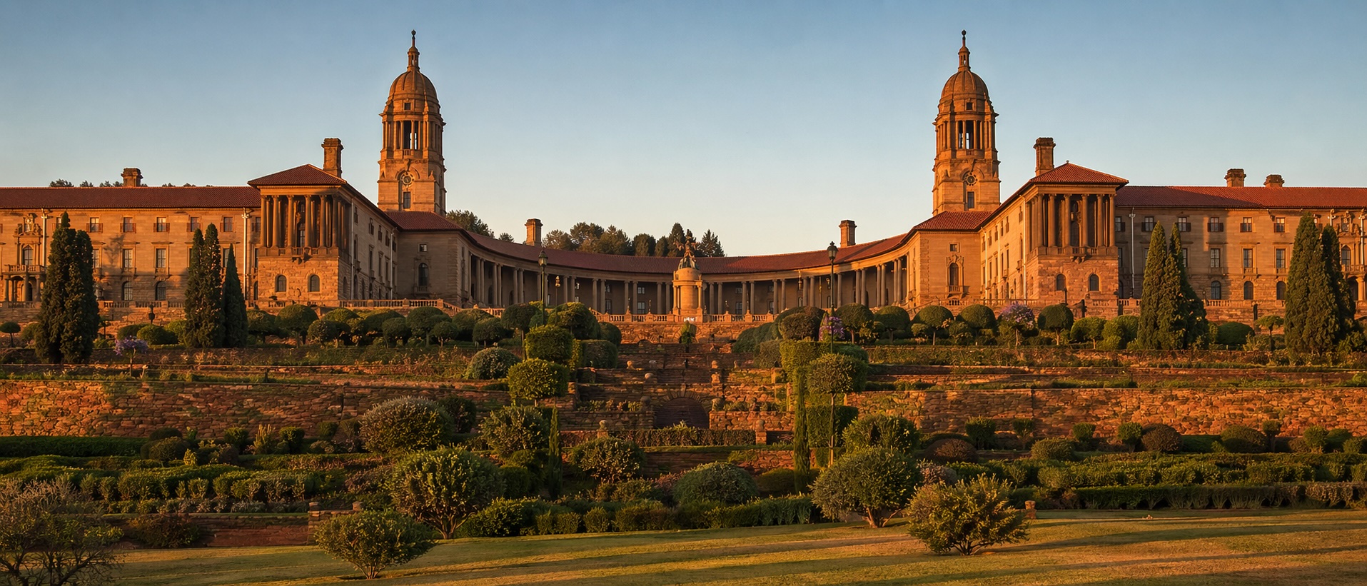 The Union Buildings in Pretoria at golden hour, seat of the South African Presidency and Cabinet, viewed across the terraced gardens.